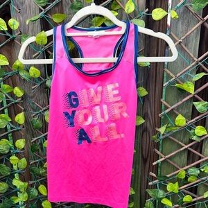 GIRL’S hot pink, racer back, tank top for those hot summer days by ponytails.